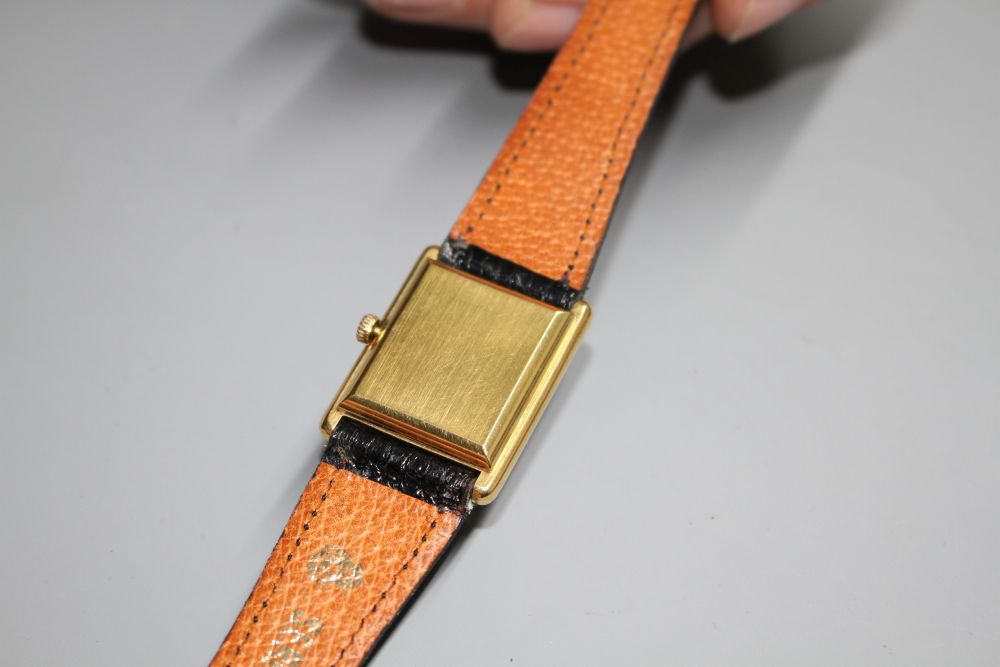 A gentlemans gold plated Omega De Ville quartz dress wrist watch, on associated strap.